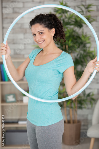 attractive woman holding hula hoop photo