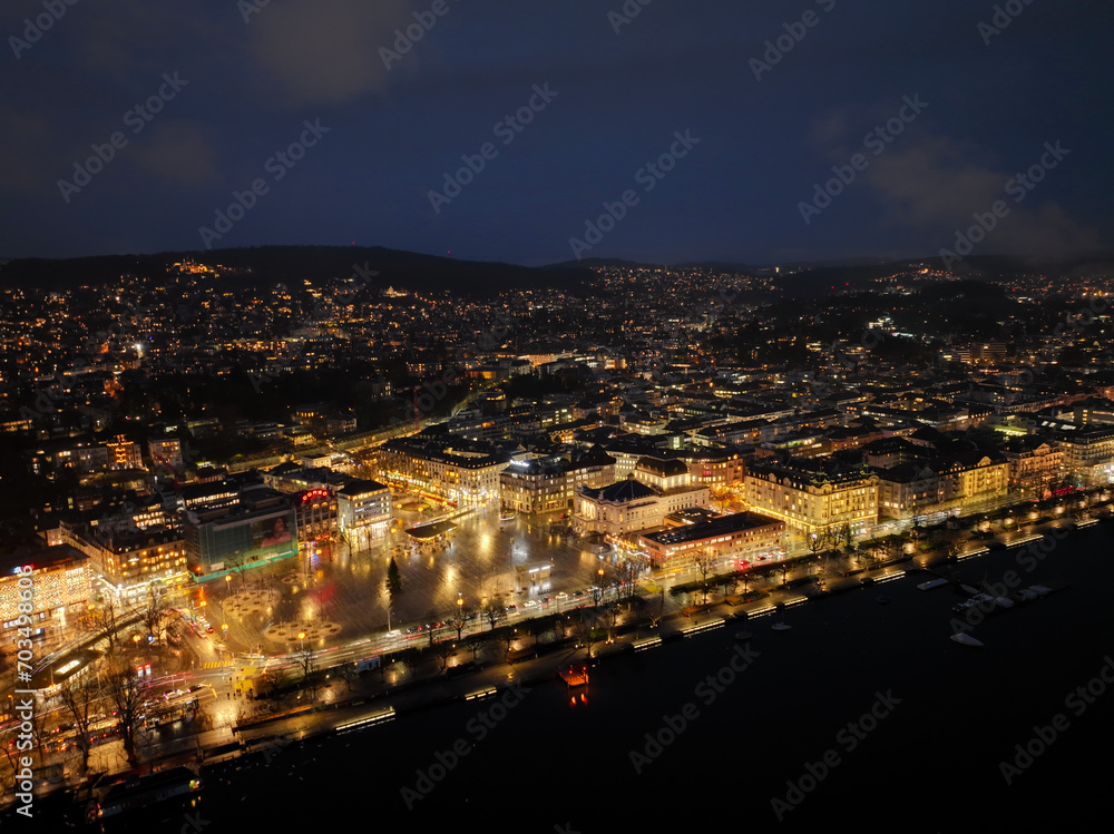 Aerial view of Swiss City of Zürich with cityscape, skyline and city lights on a dark winter night. Photo taken January 5th, 2024, Zurich, Switzerland.