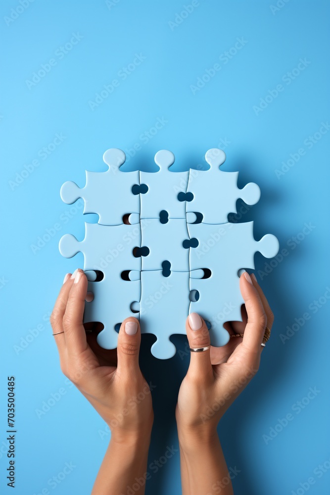 Blue puzzle pieces in hands on blue background, Blue puzzle pieces in hands on blue background,