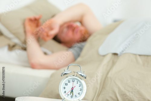 clock on a table close up man waking up photo