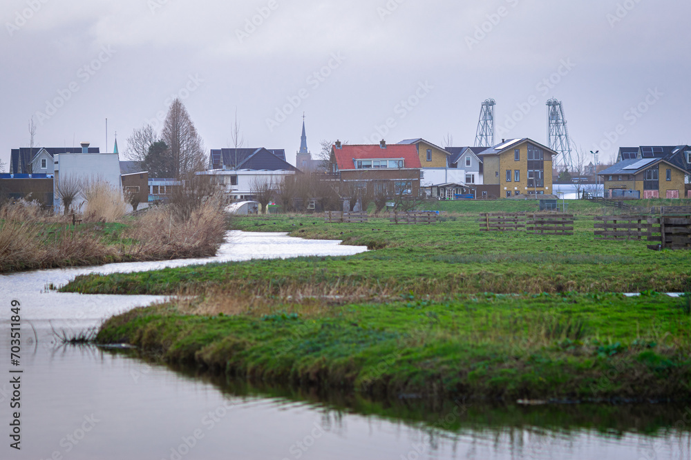Idyllic view of the Dutch watery polder landscape with the village of Boskoop in the distance