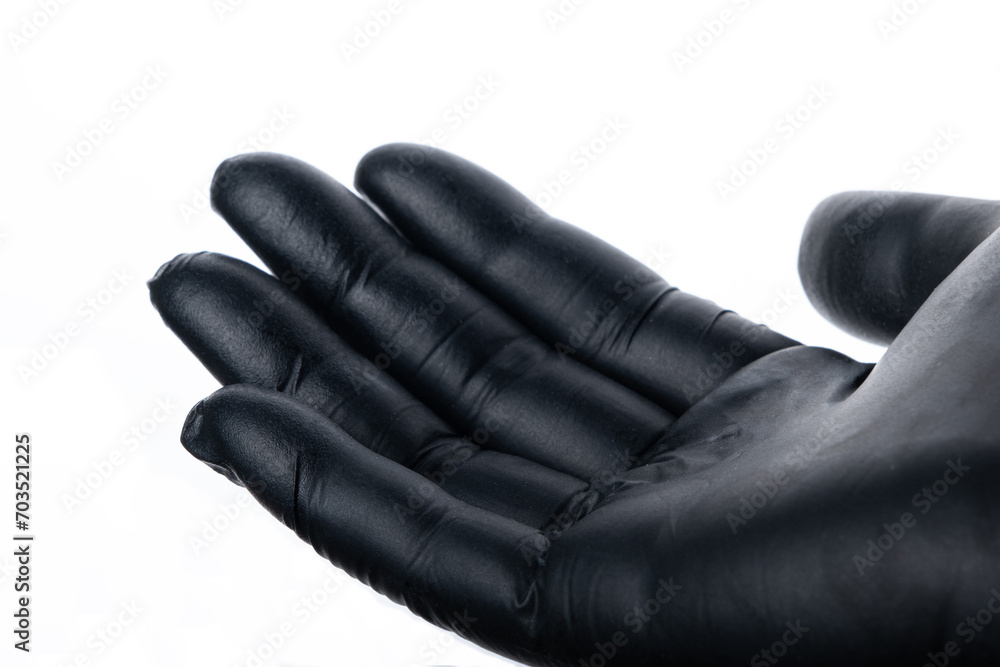Woman using black gloves isolated on white background. Selective focus. Woman using black gloves isolated on white background. Selective focus.