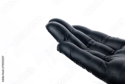 Black glove isolated on white background. Selective focus.