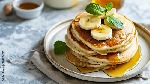 Delicious pancakes with bananas and honey