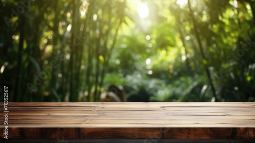 Empty Old Bamboo Table with Blurred Garden Theme in Background, Perfect for Product Display.