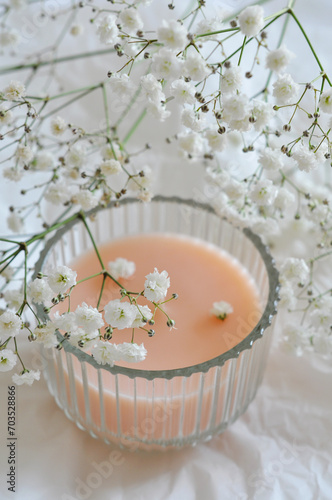 candle and beautiful white flowers