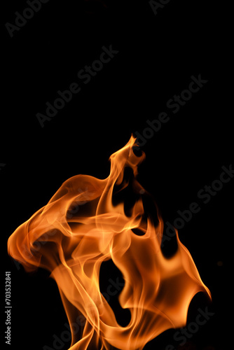 Fire flames isolated on black background, movement of fire flames abstract background 