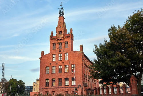 A historic, red brick building in the center of Poznan, Poland