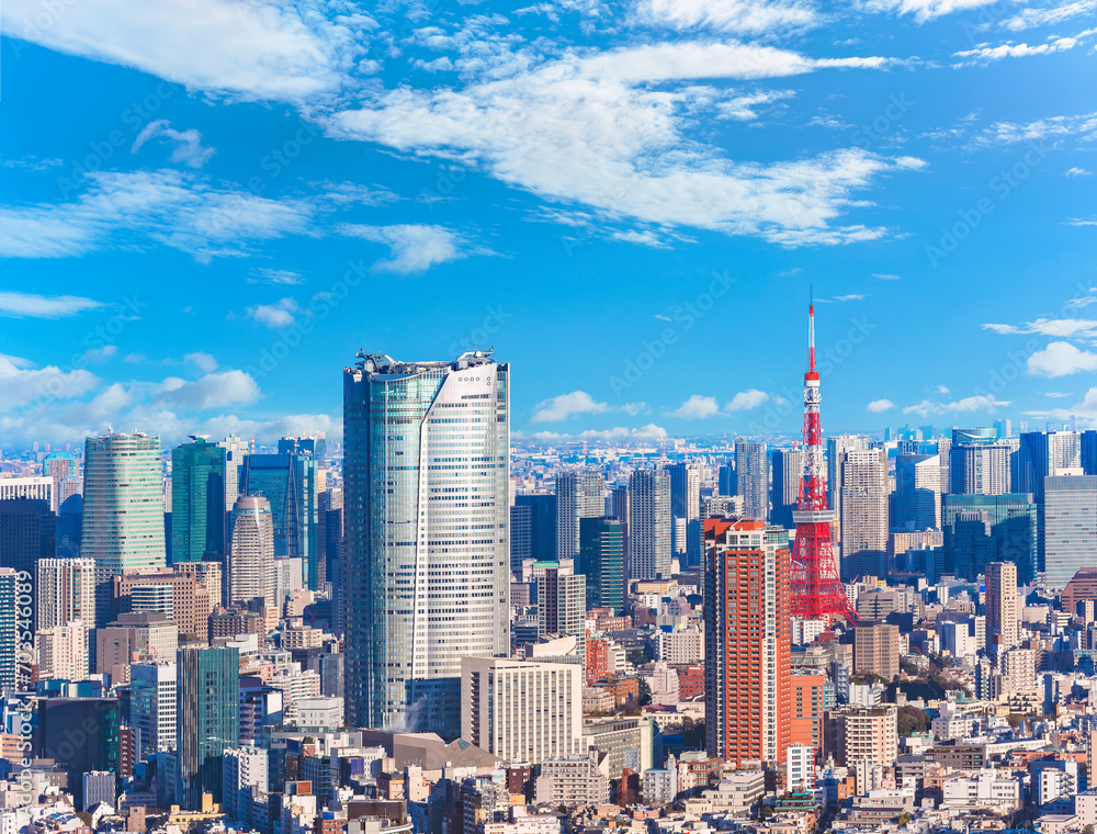 An expansive view capturing a jungle of buildings overseeing the cityscape of Roppongi and Hamamatsucho featuring the striking Roppongi Hills and Tokyo Tower, two landmarks skyscrapers of modern Japan An expansive view capturing a jungle of buildings overseeing the cityscape of Roppongi and Hamamatsucho featuring the striking Roppongi Hills and Tokyo Tower, two landmarks skyscrapers of modern Japan