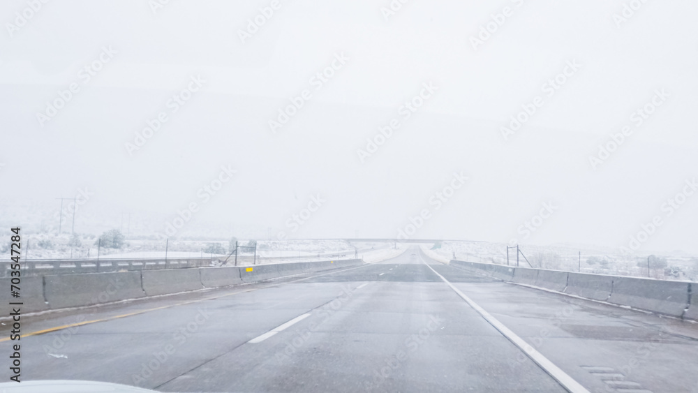 Fototapeta premium Braving a Winter Storm Driving Through Western Colorado
