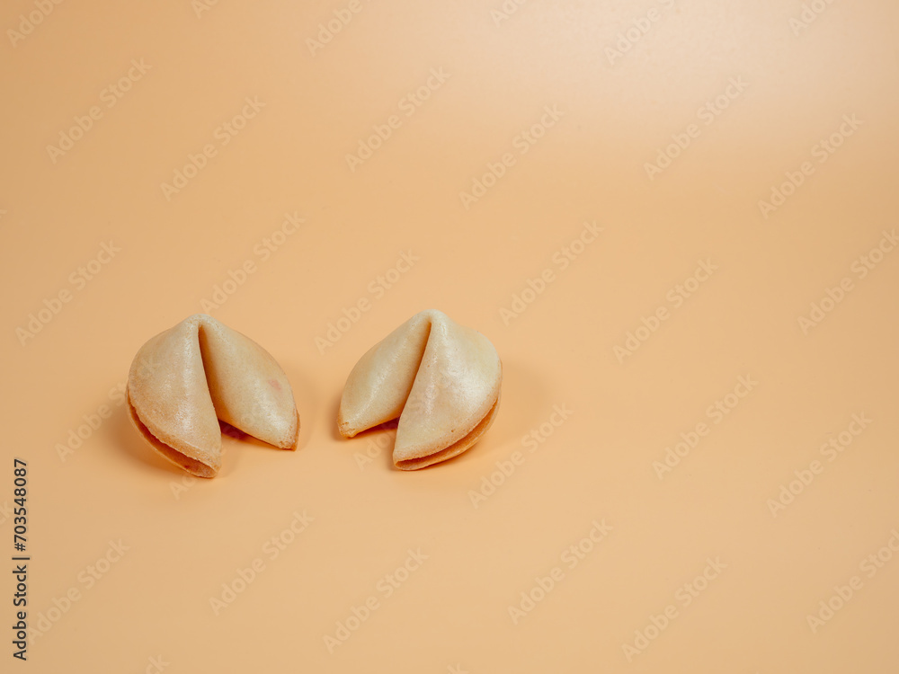 Fortune cookies on an orange background. Fortune cookies close up.