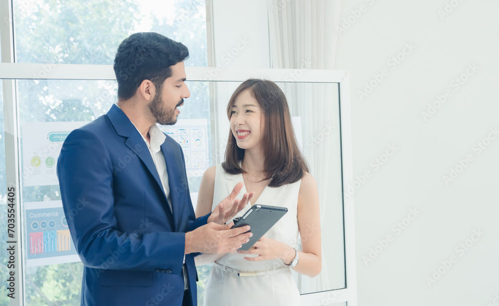 Portrait business team woman girl cute and man handsome Asian two people meeting standing looking hand holding laptop ready for presen creative idea job work success online sale inside office Portrait business team woman girl cute and man handsome Asian two people meeting standing looking hand holding laptop ready for presen creative idea job work success online sale inside office