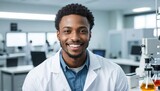 Black male scientist smiling in a well-equipped laboratory with scientific instruments.