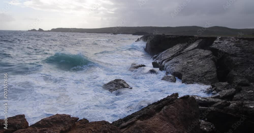 Foaming, misty ocean waves on rocky shore - steady cam shot Foaming, misty ocean waves on rocky shore - steady cam shot