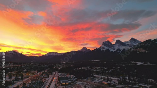 Drone footage of a beautiful sunrise over Three Sisters in Canmore, Alberta Canada photo