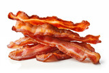 A close-up image showcasing a stack of crispy, cooked bacon strips isolated on a white background, highlighting the texture and rich color.