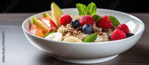 Fruit and Quinoa in a white dish.