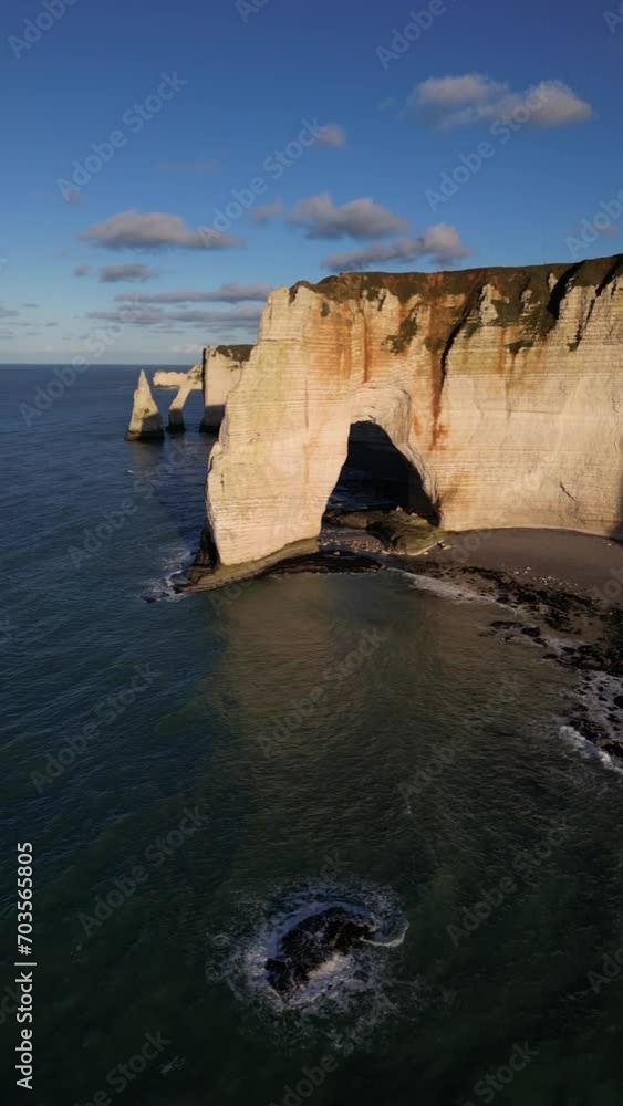 Aerial 4k drone view of Etretat. L'Aiguille, The Needle, Famous Alabaster chalk seacoast, Porte Aval cliffs, Natural Rock Arch Of Étretat, Normandy, France, Atlantic Ocean, French holidays, landscape Aerial 4k drone view of Etretat. L'Aiguille, The Needle, Famous Alabaster chalk seacoast, Porte Aval cliffs, Natural Rock Arch Of Étretat, Normandy, France, Atlantic Ocean, French holidays, landscape