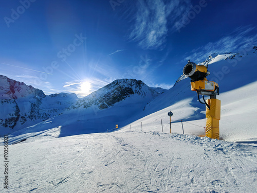 Ski slopes and chairlift in the Tiroler Alps in the Soellden ski area and the snow cannon. Austria.
