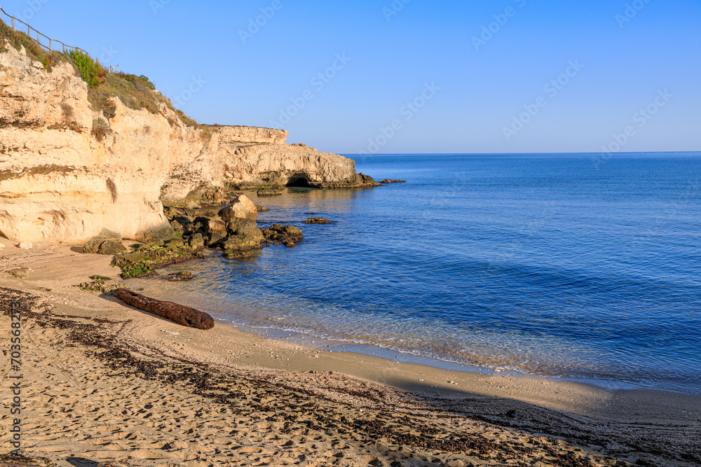 The most beautiful Apulian coast in Italy: Cala Corvino Beach. Typical coastline near Monopoli : high and rocky coast characterized by small sandy coves with cliffs, rocky arches and sea caves.