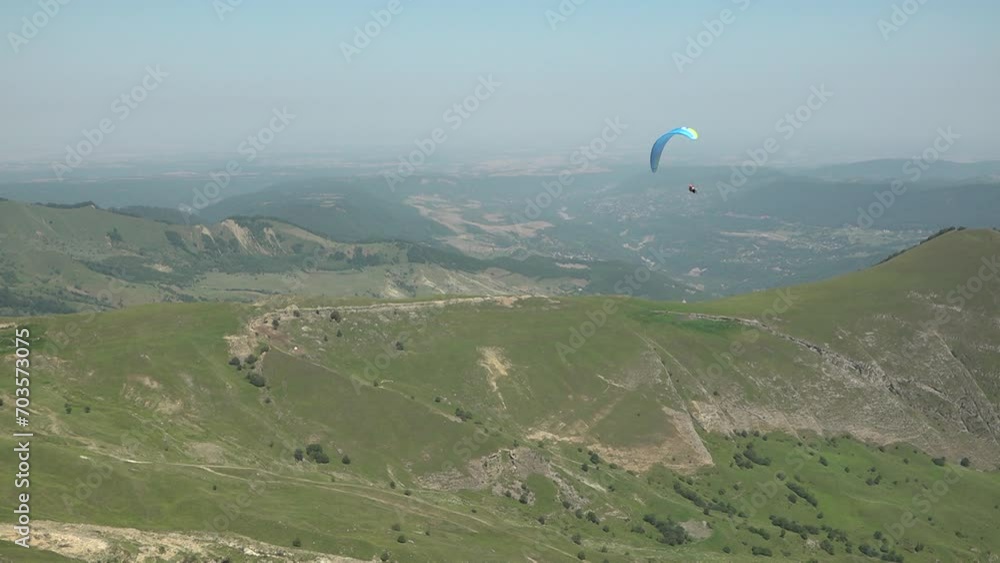 Paragliding. Paragliders jump from a mountain with a parachute Paragliding. Paragliders jump from a mountain with a parachute