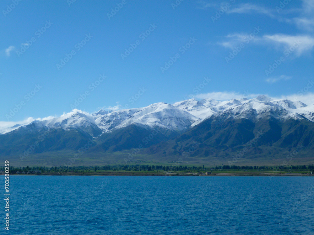 At lake Issyk-Kul, with Tian Shan Mountains