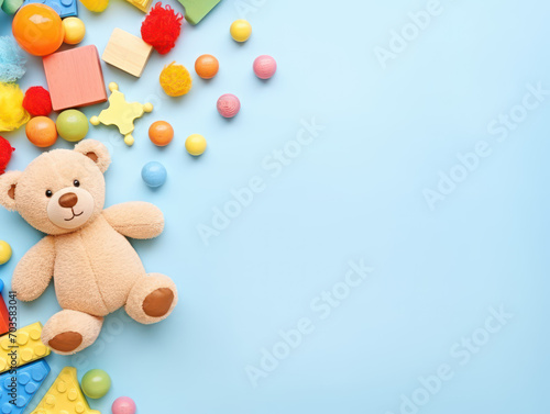 Background of children's toys and teddy bears on a pastel blue background © Kedek Creative