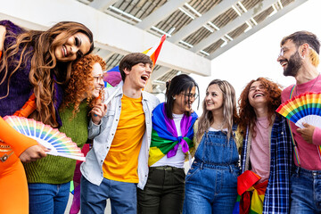 Diverse group of people enjoying gay pride day festival outdoors. LGBTQ community concept.