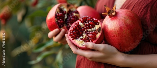 Pregnant girl improves hemoglobin by eating red pomegranate up close.