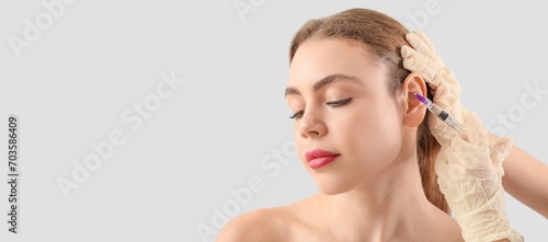 Young woman receiving fille...