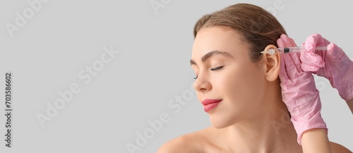 Young woman receiving fille...