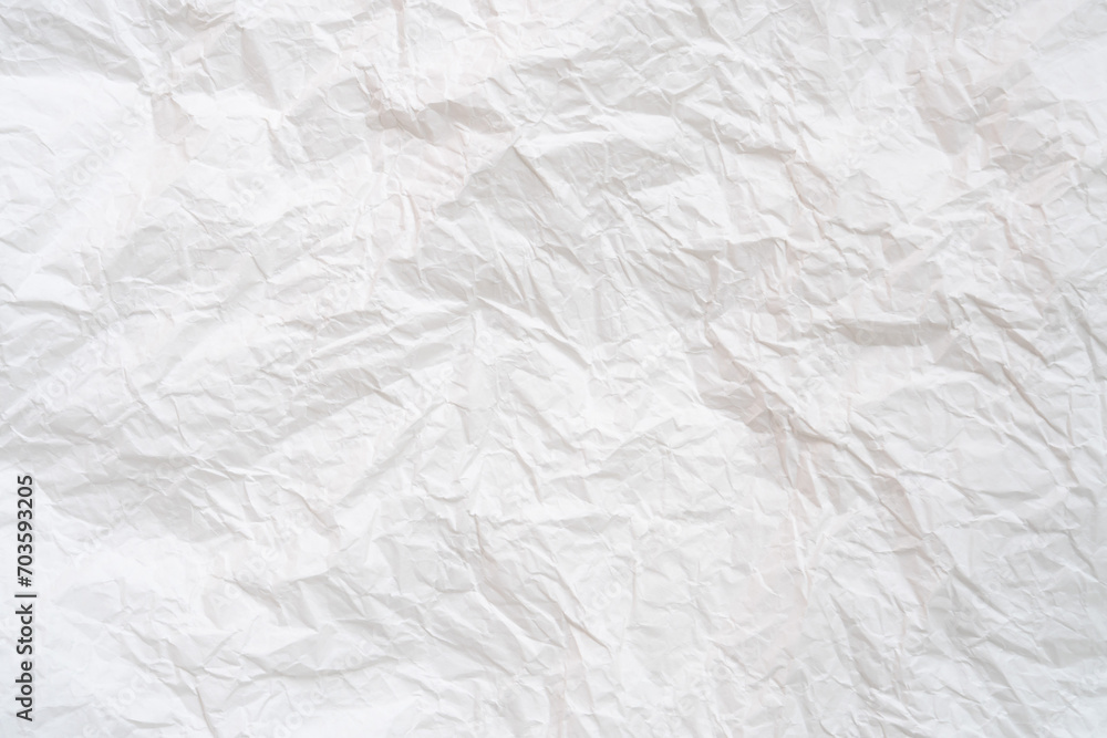 Wrinkled or crumpled white stencil or tissue paper used for crumpled paper background texture..