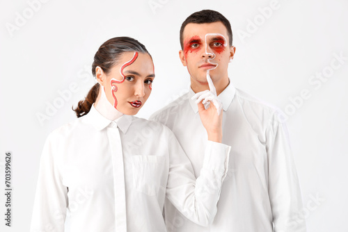 Young couple with painted f...