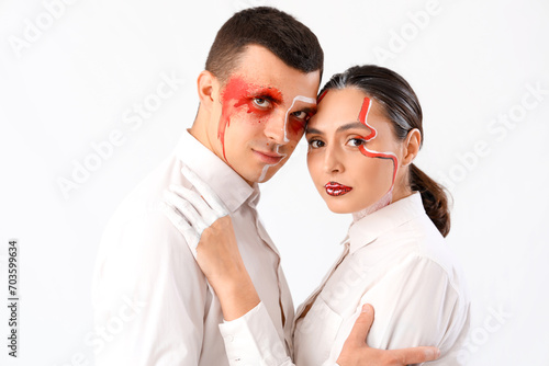 Young couple with painted f...