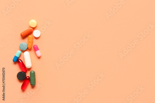 Composition with colorful pills on color background