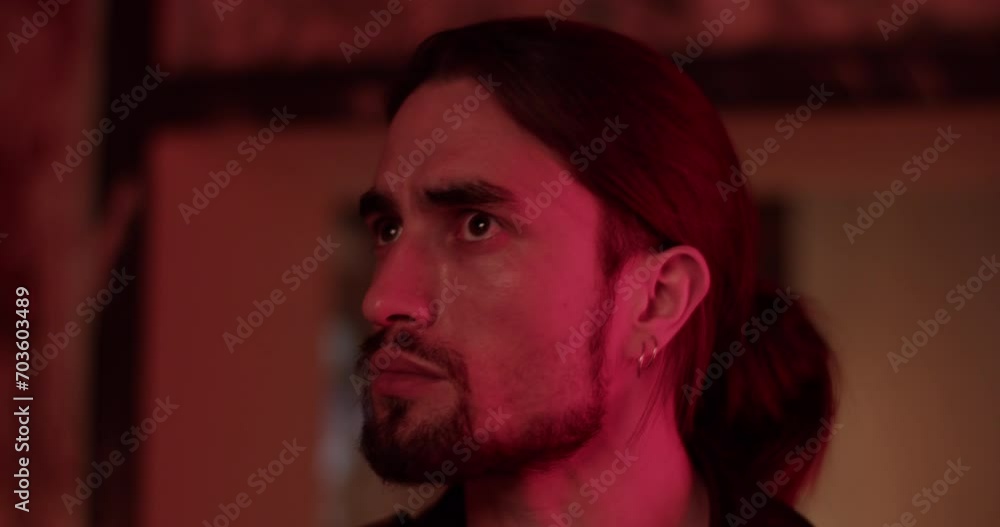 Young man looking around in room Young man looking around in room