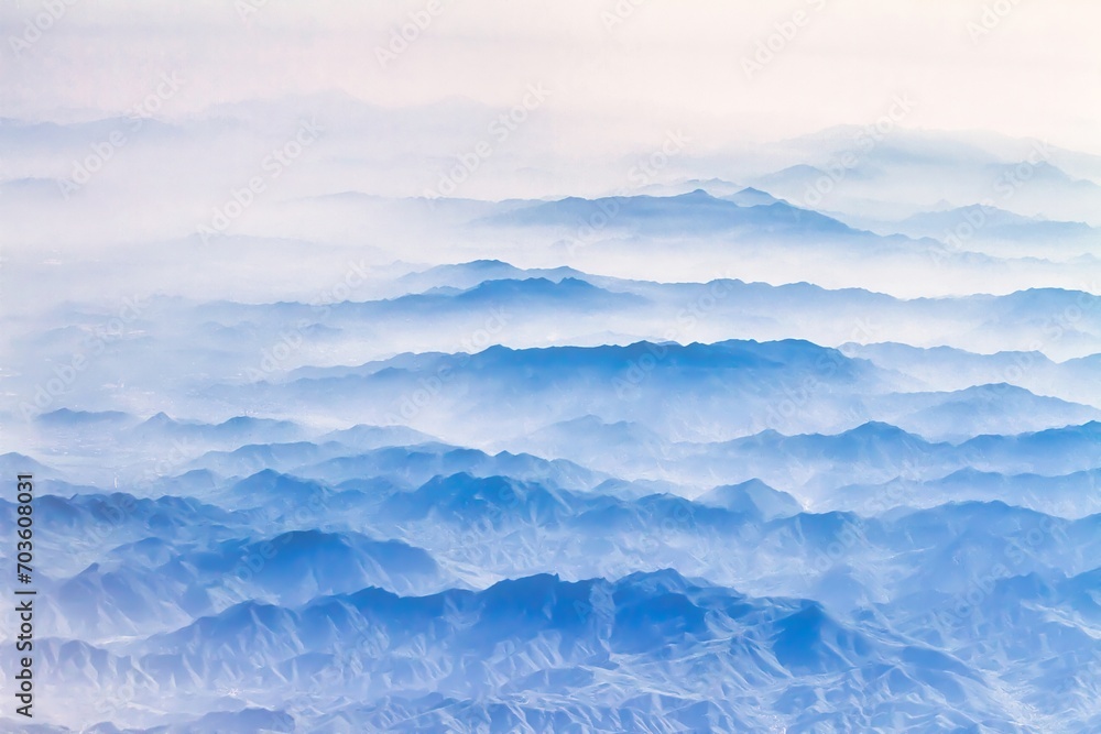Beijing, China - July 17 2010 : mysterious looking morning fog hangs deep in the valleys and only mountain summits are visible