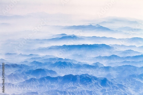 Beijing, China - July 17 2010 : mysterious looking morning fog hangs deep in the valleys and only mountain summits are visible
