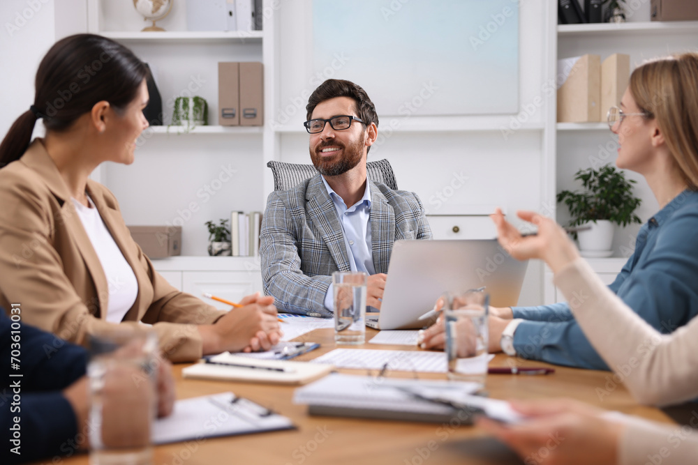 Team of employees working together in office Team of employees working together in office