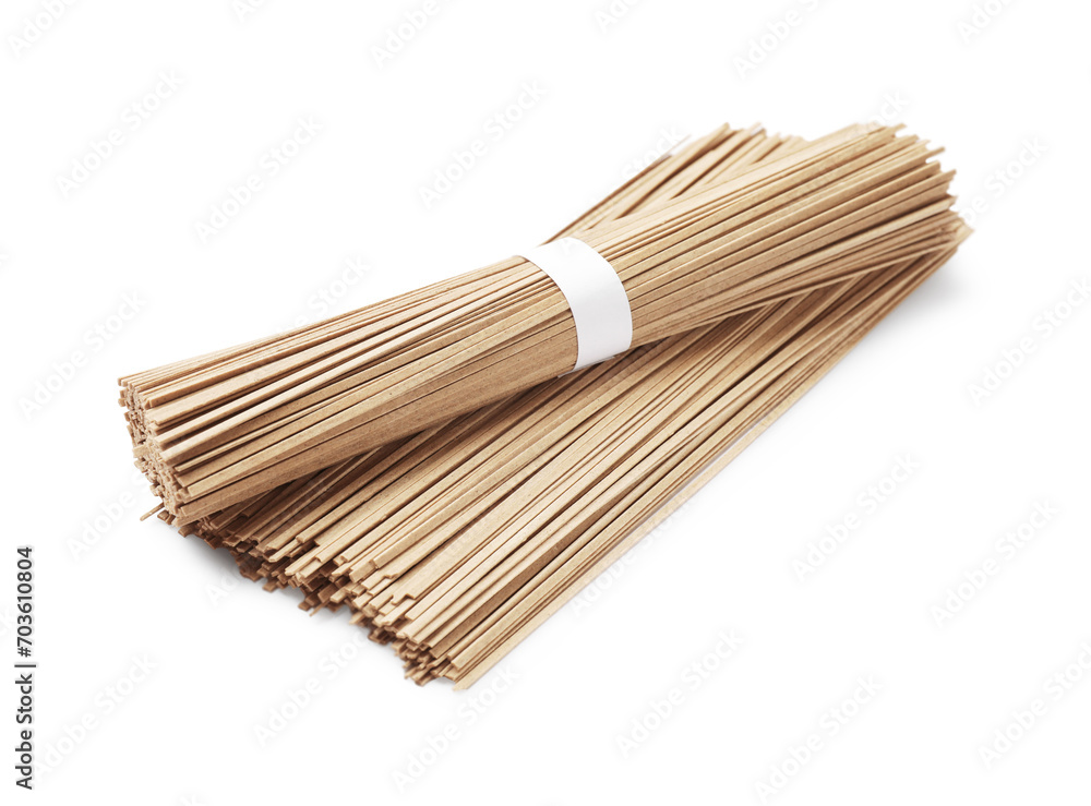 Uncooked buckwheat noodles (soba) isolated on white Uncooked buckwheat noodles (soba) isolated on white