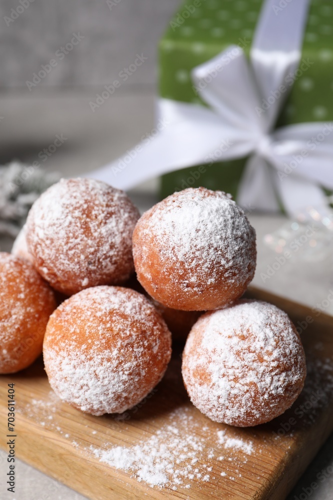 Delicious sweet buns with powdered sugar on table, closeup Delicious sweet buns with powdered sugar on table, closeup