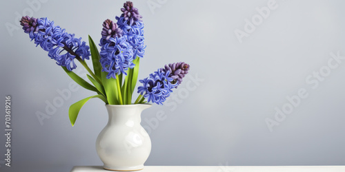 Spring hyacinths in a vase on a light background