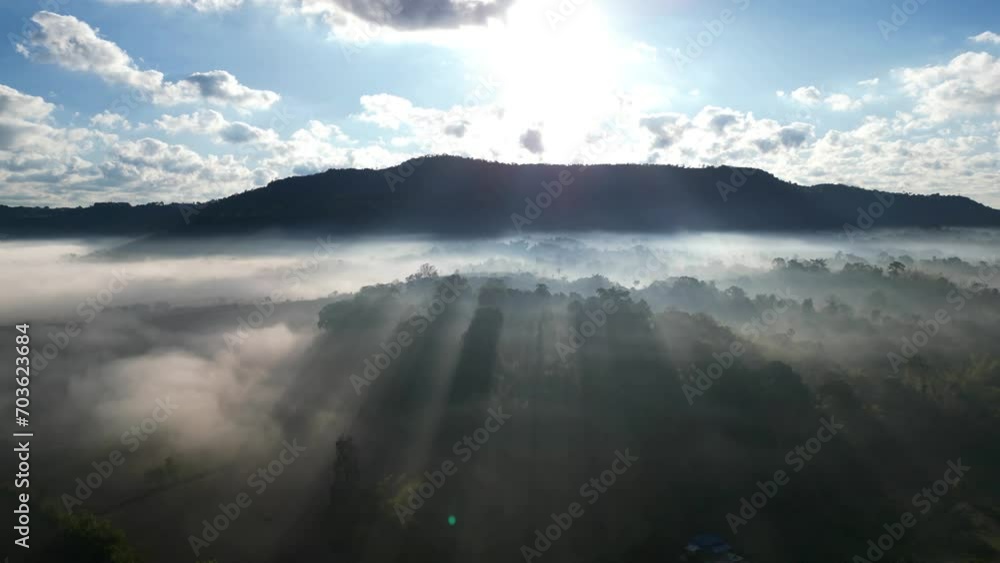Aerial view of flowing fog waves on mountain tropical rainforest.Khao Kho, Phetchabun, Thailand. Aerial view of flowing fog waves on mountain tropical rainforest.Khao Kho, Phetchabun, Thailand.