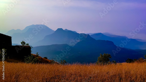 Grass and sahyadri mountains view from the raigad fort in maharashtra in India  photo