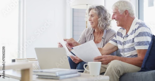 Senior couple, budget and documents for finance, asset management or pension investment plan. Happy man, woman and reading paperwork of banking report, bills or insurance policy of retirement savings photo