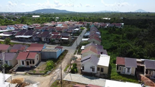 Aerial view of subsidized housing (KPR) on a wide and green land photo