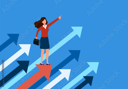 Leadership, leading to success or business vision concept. Businesswoman is pointing direction forward and standing on flying arrows.