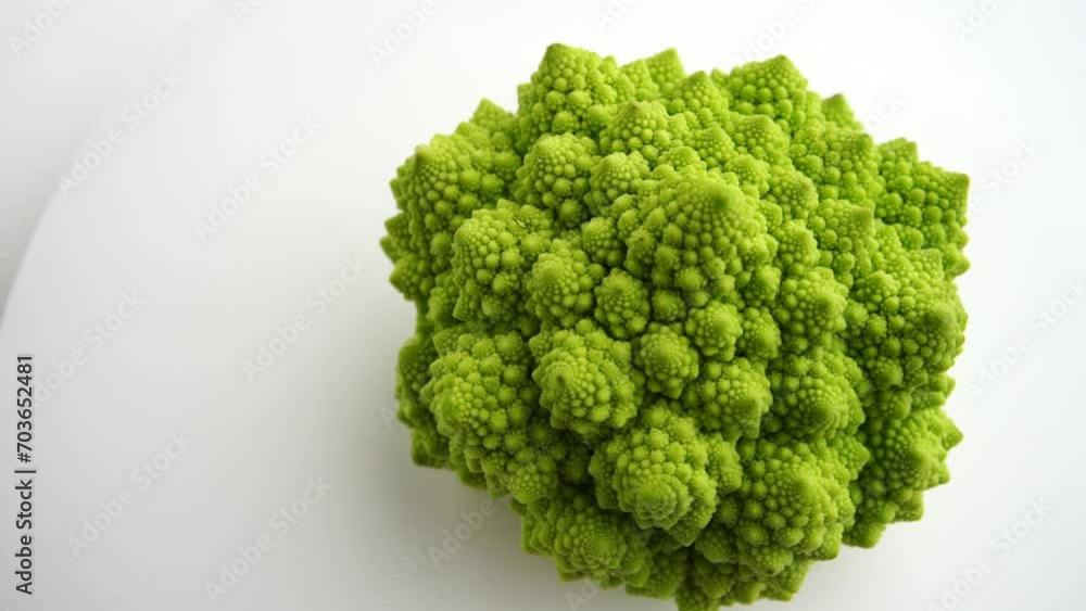 Fresh raw cauliflower romanesco rotating on white background.Green Head of Cabbage with Close up slow motion shot. Romanesco broccoli, Roman cauliflower, Broccolo Romanesco Fresh raw cauliflower romanesco rotating on white background.Green Head of Cabbage with Close up slow motion shot. Romanesco broccoli, Roman cauliflower, Broccolo Romanesco