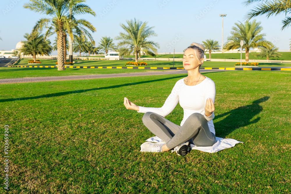 woman doing yoga fitness and yoga park practice in the morning for wellness woman doing yoga fitness and yoga park practice in the morning for wellness