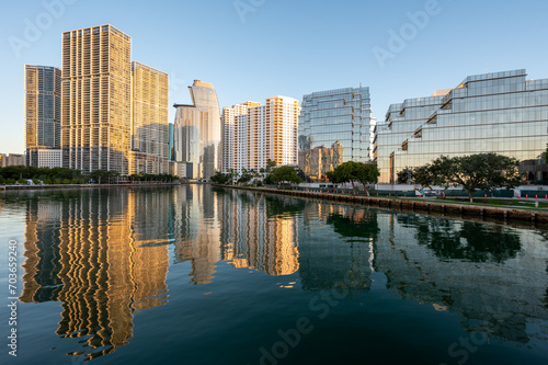 City of Miami, Florida skyline reflected in calm water of Biscayne Bay at sunrise on clear cloudless December morning. © Francisco